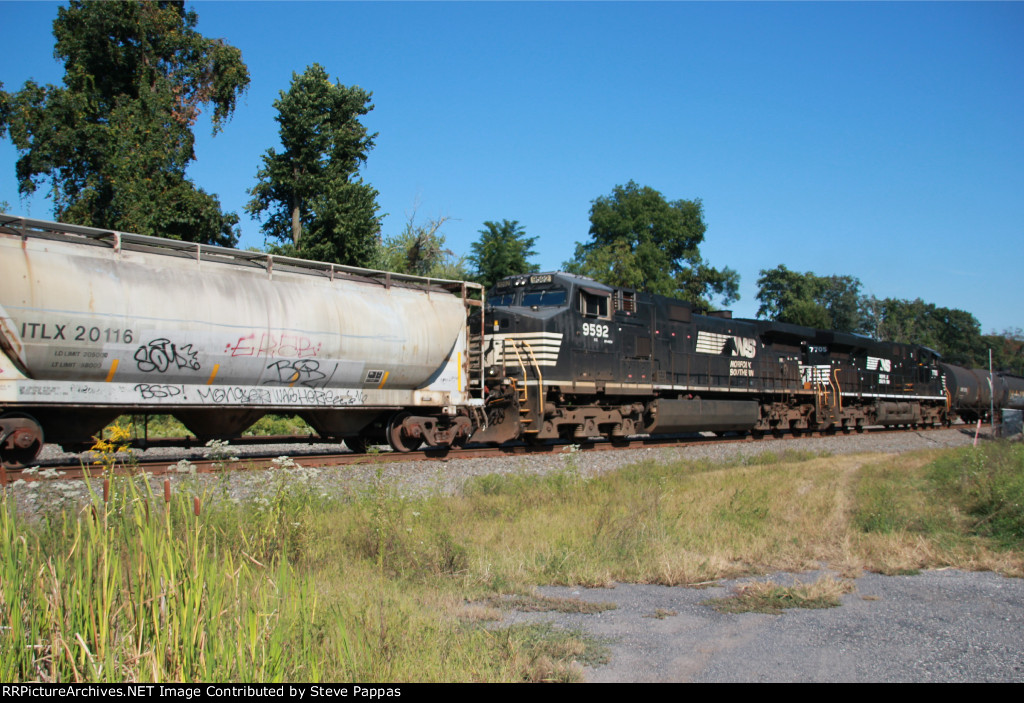 NS 9592 and 7705 as mid-train units on a westbound